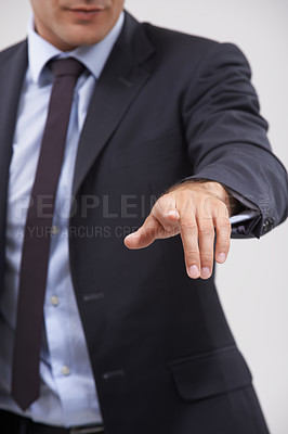 Buy stock photo Businessman, hand and pointing with interface for touch, UX or UI on a gray studio background. Closeup of young man, user or employee with interaction for virtual technology, push or click on icon