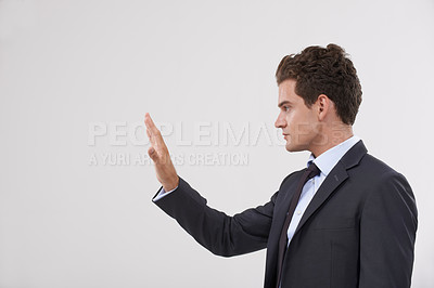 Buy stock photo Businessman, palm and interaction with mockup space or virtual interface on a gray studio background. Isolated young man, model or profile of employee with hand touching display, interactive UI or UX