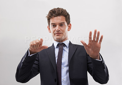 Buy stock photo Business, man and confident with a digital interface in studio on white background for company research and ideas. Male person, technology and click for user experience with digital transformation.