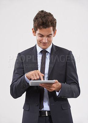 Buy stock photo Business, typing and man holding a tablet, communication or connection on white studio background. Web, person or model with tech, internet and social media with email notification and digital app