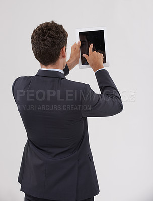 Buy stock photo Businessman, tablet and screen with studio, internet and entrepreneur for corporate app. Man, tech and suit with employee, worker and technology from behind for future startup and career with mockup