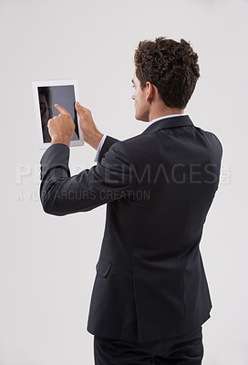 Buy stock photo Businessman, tablet and screen with studio, internet and entrepreneur for corporate app. Man, tech and suit with employee, worker and technology from behind for future startup and career or job