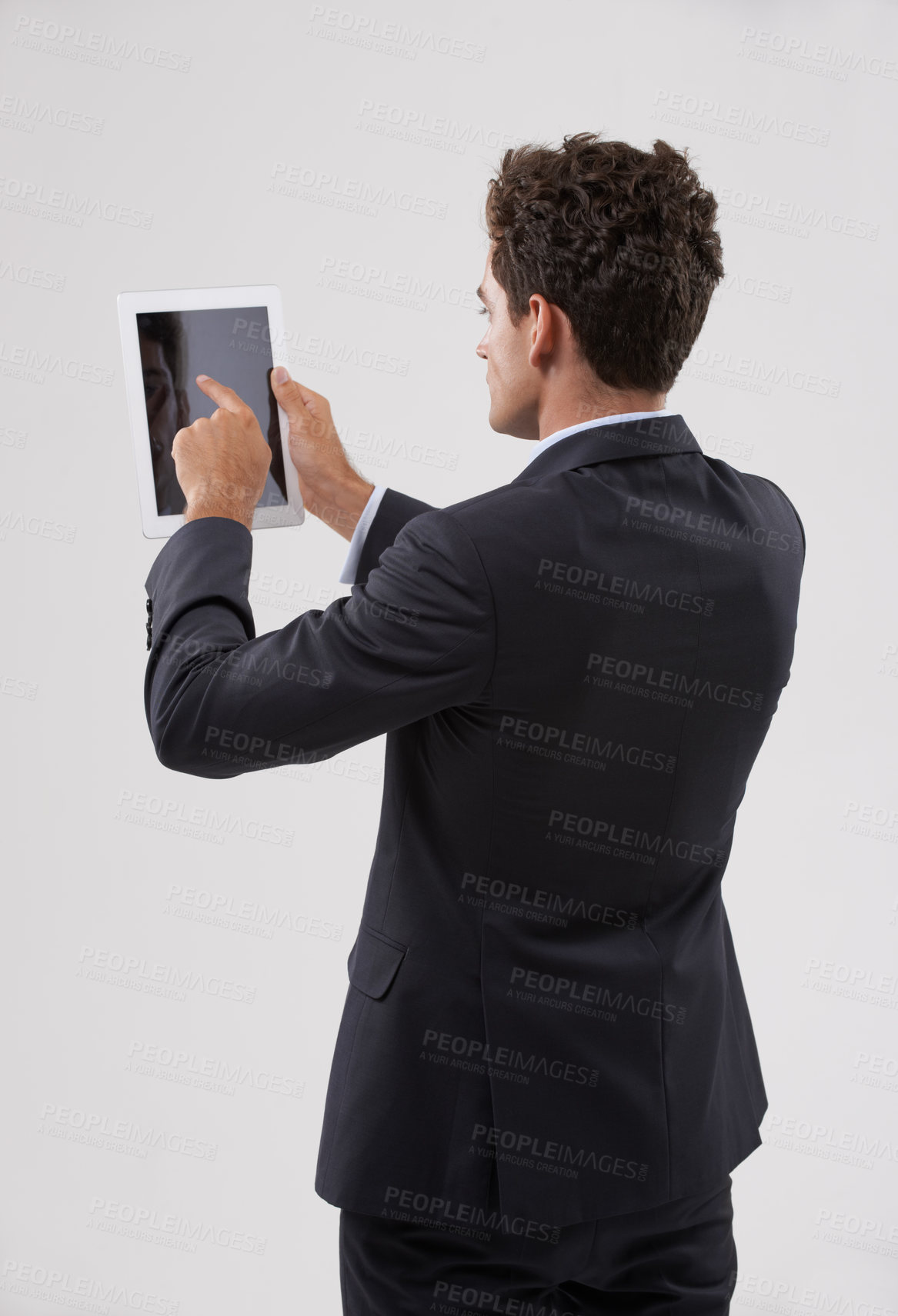 Buy stock photo Businessman, tablet and screen with studio, internet and entrepreneur for corporate app. Man, tech and suit with employee, worker and technology from behind for future startup and career or job