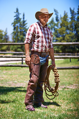 Buy stock photo Farm, ranch and portrait of senior cowboy with rope lasso for horse, cows and rodeo animals for agriculture. Farming, nature and mature man in environment, countryside and working outdoors in Texas