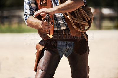 Buy stock photo Cowboy, confrontation and aim gun to shoot for standoff or gunfight in duel for wild western culture in Texas. Male gunslinger or outlaw, revolver and tough for defense or conflict with closeup