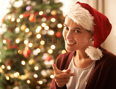 Buy stock photo Christmas, portrait or woman for finger, warning or naughty in playful break in festive season. Gen z female person, red hat or smile to hey you, no or humor to relax in living room, tree and lights