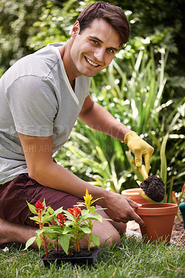 Buy stock photo Portrait of a handsome young man gardening outdoors