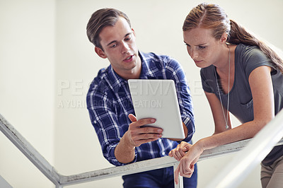 Buy stock photo Business people, tablet and discussion on staircase for online research, teamwork and idea for project. Professional employees, meeting and technology for planning, networking or feedback on job