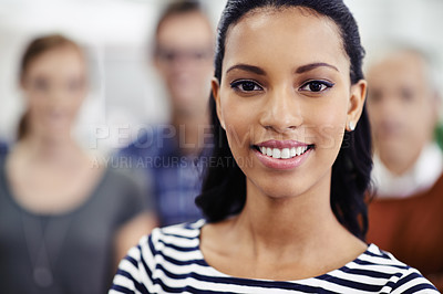 Buy stock photo Woman, smile and portrait in office for business, career or startup at company with coworkers indoor. Intern, trainee or journalist with colleagues for collaboration, professional job or project 