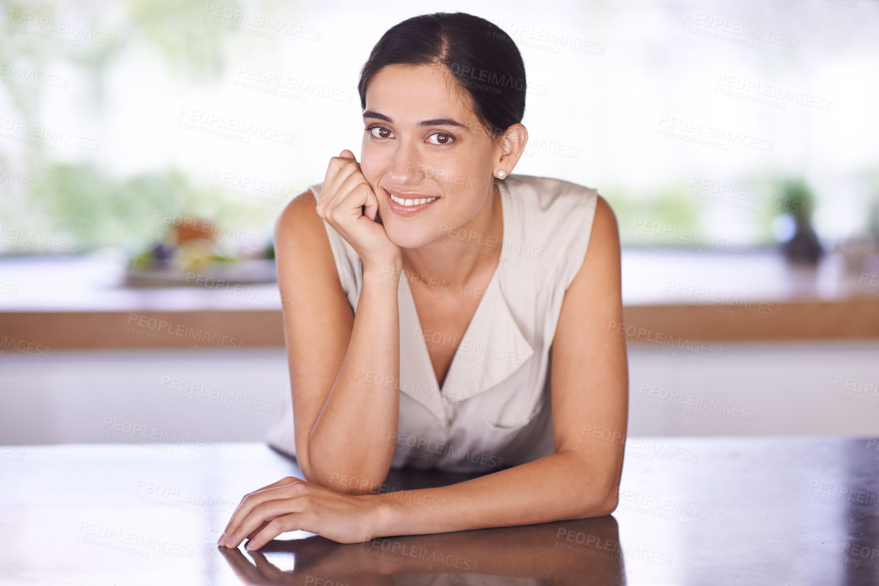 Buy stock photo Portrait of an attractive young woman standing in her kitchen