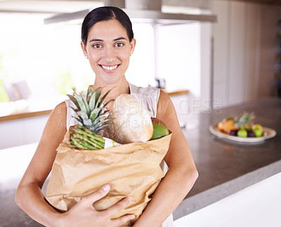 Buy stock photo Groceries, bag and portrait of woman with healthy food in kitchen for nutrition, diet or cooking in home. Happy, wellness and person with a smile for fruits, vegetables and eating with balance
