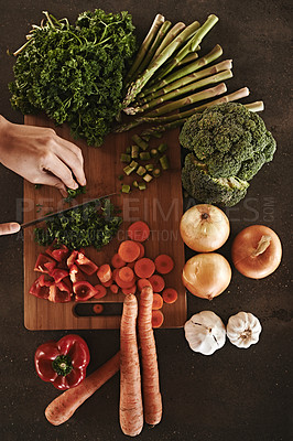 Buy stock photo Healthy, hands and knife with vegetables, chopping board and food with ingredients and wellness. Closeup, utensils and chef with salad and lunch with diet plan and dinner meal 
 with vegan and person