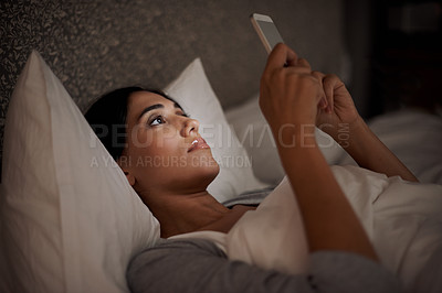 Buy stock photo Woman, scroll and phone for social media, bed and relaxation under blankets in pajamas to sleep. Female person, browse and tech for peace, night and online for conversation, chat and meme leisure