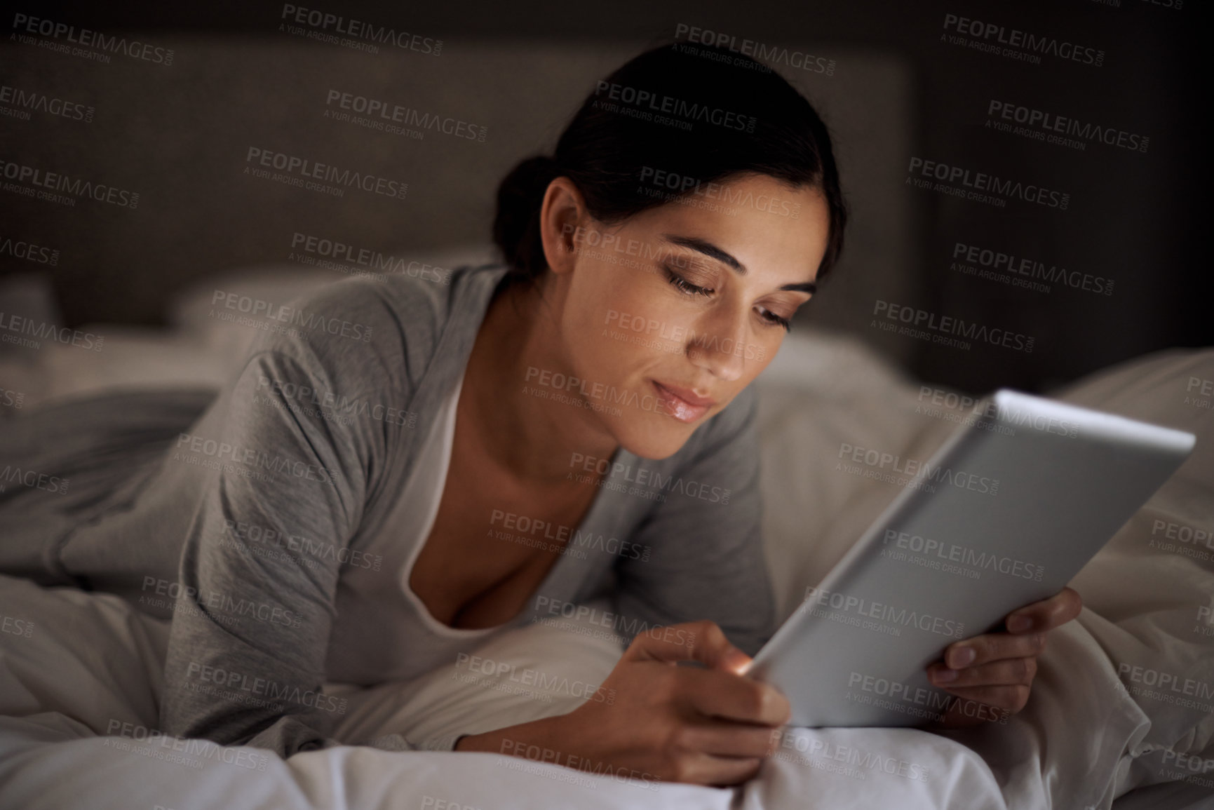 Buy stock photo House, bedroom and woman reading with tablet on app, online with connection to internet. Night, female person and girl download ebook for romance with technology to relax on bed, break and weekend
