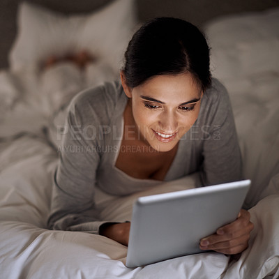 Buy stock photo Night, bedroom and woman with smile for tablet on social media, chatting and texting on site of app. Bed, female person and girl with technology for reading ebook to relax and online with internet 