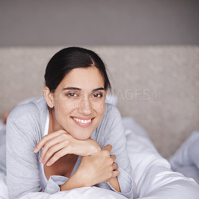 Buy stock photo Portrait, bed and smile of happy woman, bedroom and home for comfort and sleep. Duvet, relax and bedding in room for rest for fatigue, wellness and refresh or joy on weekend chill in pyjamas 