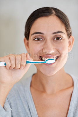 Buy stock photo Woman, portrait and brushing teeth with smile in home for health, wellness or care for breath in morning. Girl, person and happy with toothbrush, mouth and cleaning for hygiene at apartment in Chile