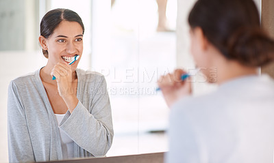 Buy stock photo Woman, brushing teeth and happy in home by mirror for health, wellness or self care for breath in morning. Girl, person and smile with toothbrush, mouth and cleaning for hygiene at apartment in Chile