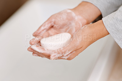 Buy stock photo Cropped shot of a woman washing her hands with soap