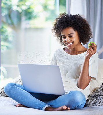 Buy stock photo Apple, fresh produce and woman on sofa with laptop for social media, lifestyle blog and food website at home. Happy female person, technology and fruit for nutrition, healthy diet and clean eating