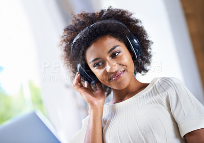 Buy stock photo Face, music on laptop and smile with black woman in living room of home for relax or radio streaming. Computer, headphones and internet with happy young person in apartment for social media browsing