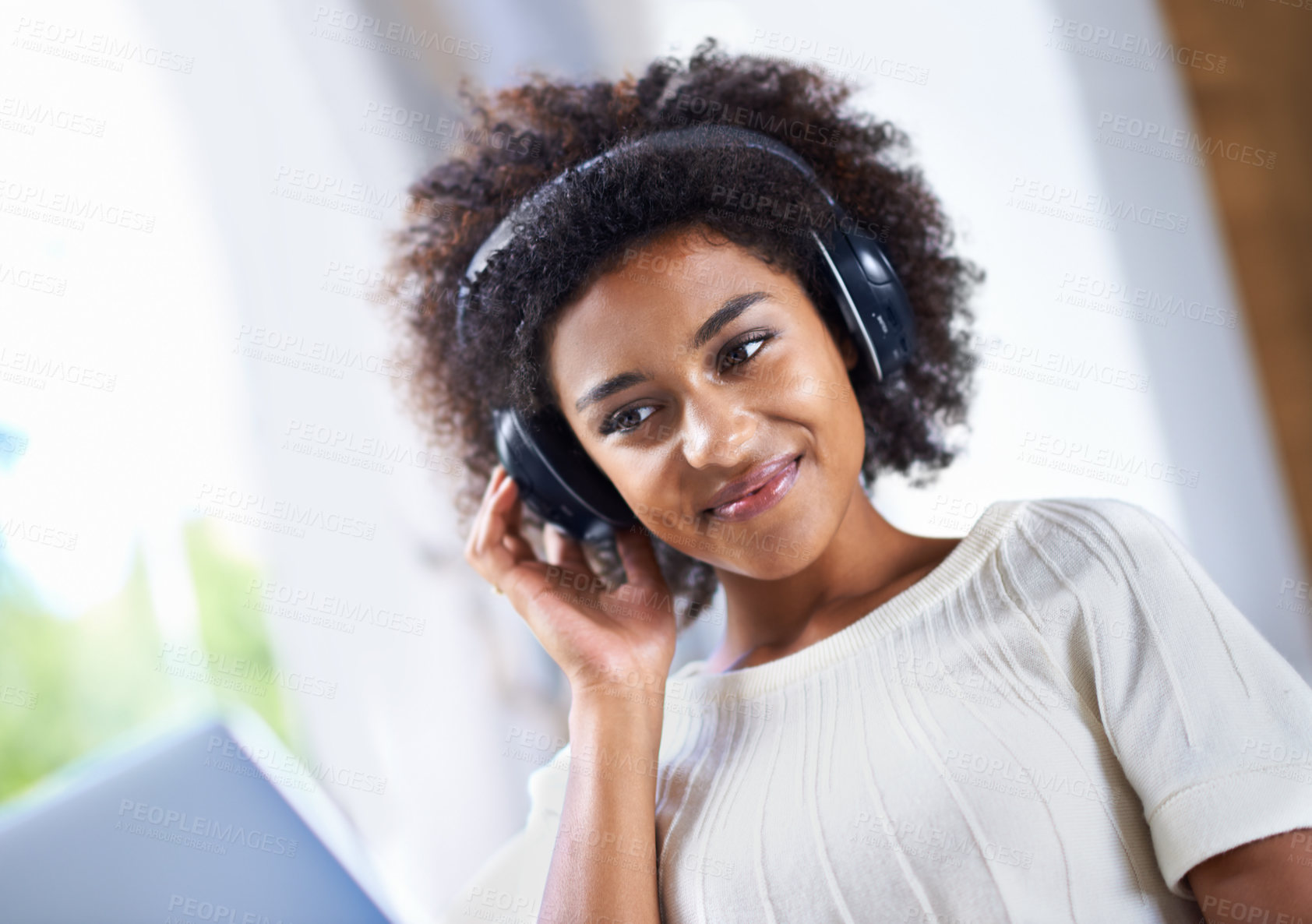 Buy stock photo Face, music on laptop and smile with black woman in living room of home for relax or radio streaming. Computer, headphones and internet with happy young person in apartment for social media browsing