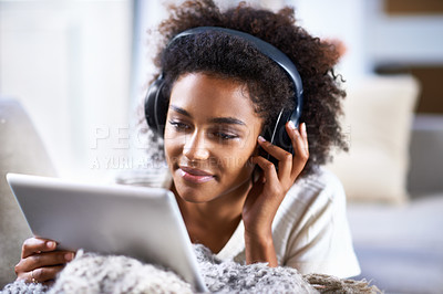 Buy stock photo Tablet, headphone and smile for happy woman, lounge and streaming or movies for entertainment. Relax, weekend and technology for social media, communication and online scrolling for African female 