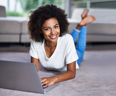 Buy stock photo Carpet, laptop and portrait of woman on floor working on freelance creative project in living room. Happy, technology and African female designer typing on computer for research on rug in apartment.