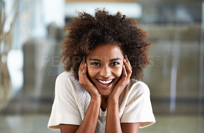 Buy stock photo Smile, African woman person and happy in home lounge, positive and joyful in living room. Hands, laugh and positive expression on face of female person, afro and comfort or relax at house on weekend