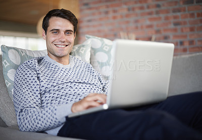Buy stock photo Relax, smile or portrait of man on laptop for remote work, article post website or network online. Freelancer, research or happy person on sofa typing on technology for startup, email or news in home