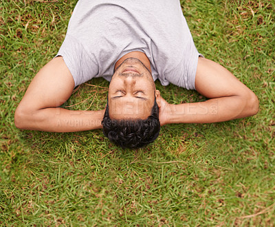 Buy stock photo Man, outdoor and sleep on lawn, grass and eyes closed in dreaming outside for summer in nature. Male person, backyard and adult to relax, peace and vacation in garden or park for peace and calm