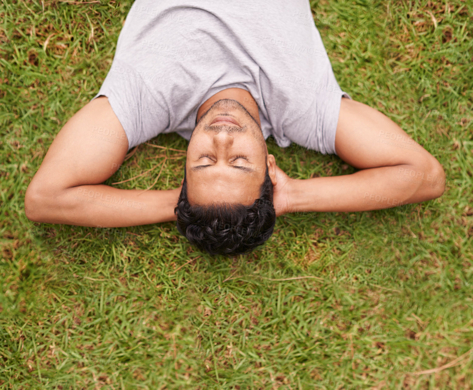 Buy stock photo Man, outdoor and sleep on lawn, grass and eyes closed in dreaming outside for summer in nature. Male person, backyard and adult to relax, peace and vacation in garden or park for peace and calm