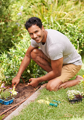 Buy stock photo Portrait, smile and man in a garden, sunshine and summer with earth and grass with weekend break. Person, outdoor and guy with tools and backyard with environment and nature with fresh air and lawn