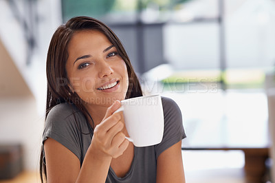 Buy stock photo Portrait, coffee and relax with woman in kitchen of home to relax in morning or on weekend time off. Face, smile and mug with happy young person drinking tea in apartment for peace or wellness