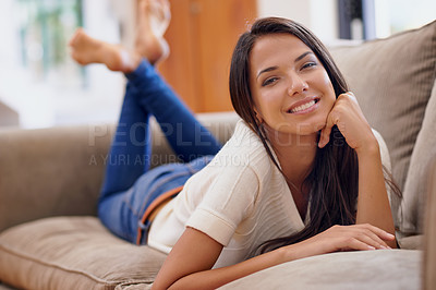 Buy stock photo Woman, portrait and smile on sofa for relax weekend or comfortable day off for holiday break, vacation or peace. Female person, face and resting on couch in Mexico apartment, lounge or stress relief