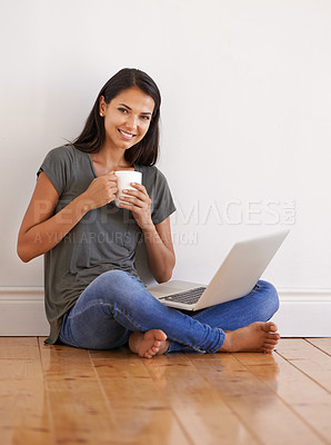 Buy stock photo Floor, laptop and portrait of woman blogging with smile by wall background of apartment with tea or coffee. Happiness, female person and girl online on app writing novel with internet connection