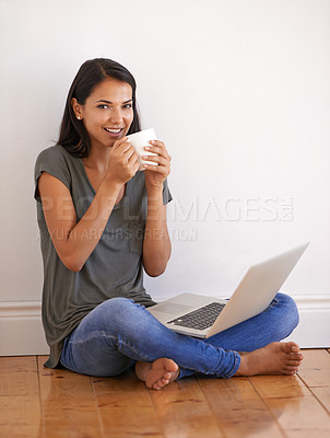 Buy stock photo Floor, laptop and  portrait of woman with mug in apartment by wall of home with tea or coffee. Happiness, female person and student in college studying online with technology for exam in new house