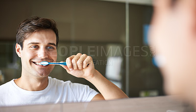 Buy stock photo Brushing teeth, man and cleaning in a bathroom at home for oral hygiene and health. Smile, dental and toothbrush with a male person with happiness in the morning at a house with mirror reflection