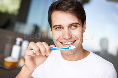 Buy stock photo Closeup of a young man brushing his teeth