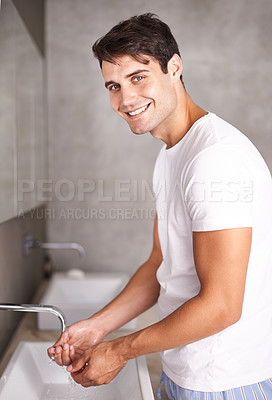 Buy stock photo Portrait, smile and man washing hands in bathroom of home for morning grooming, hydration or hygiene. Cleaning, water and wellness with happy young person in apartment for self care at basin