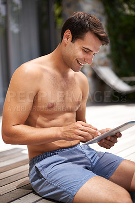 Buy stock photo Poolside, tablet and happy man on a deck with internet, search or streaming in his backyard. Digital, app or male person outdoor online for social media, scroll or web communication, games or reading