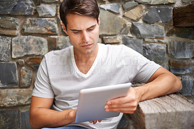Buy stock photo Tablet, search and man at a restaurant outdoor with website, menu or checking food, order or options. Digital, app and male person at a cafe with customer experience survey, review or online feedback