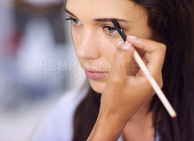 Buy stock photo A young woman having makeup applied