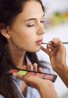 Buy stock photo Woman, makeup artist and hand for lipstick application or beauty treatment with cosmetic products, preparation or mouth. Female person, finger and brush for makeover glamour, skincare or professional