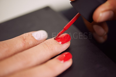 Buy stock photo Woman, hands and manicure with red nail polish for beauty, cosmetics or finger treatment at salon. Closeup of female person or stylist applying glow, shine or glamour on cuticles for makeup or art