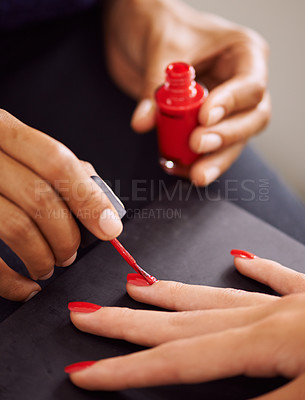 Buy stock photo Closeup of fingernails being painted red