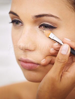 Buy stock photo Woman, makeup and cosmetics with brush for facial treatment, beauty or eye shadow at home. Closeup of female person, face or model applying foundation, contour or glow for skincare, color or glamour