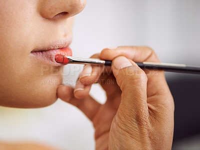 Buy stock photo Closeup, woman and makeup brush on lips for beauty with hands, application of cosmetics product and glamour. Person, mouth and color lipstick for skincare, aesthetic makeover and cosmetology at salon