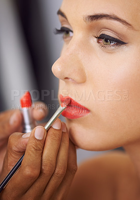 Buy stock photo Cropped shot of a woman having her lips filled in with colour