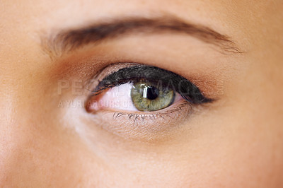 Buy stock photo Closeup of a vivid green eye with thick mascara-coated lashes